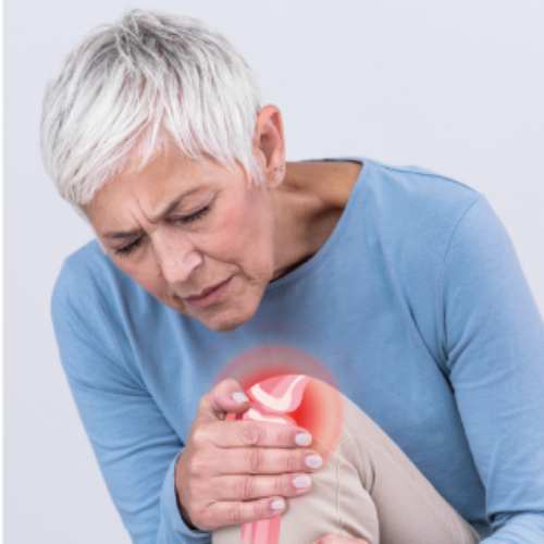 senior woman favouring her aching knee